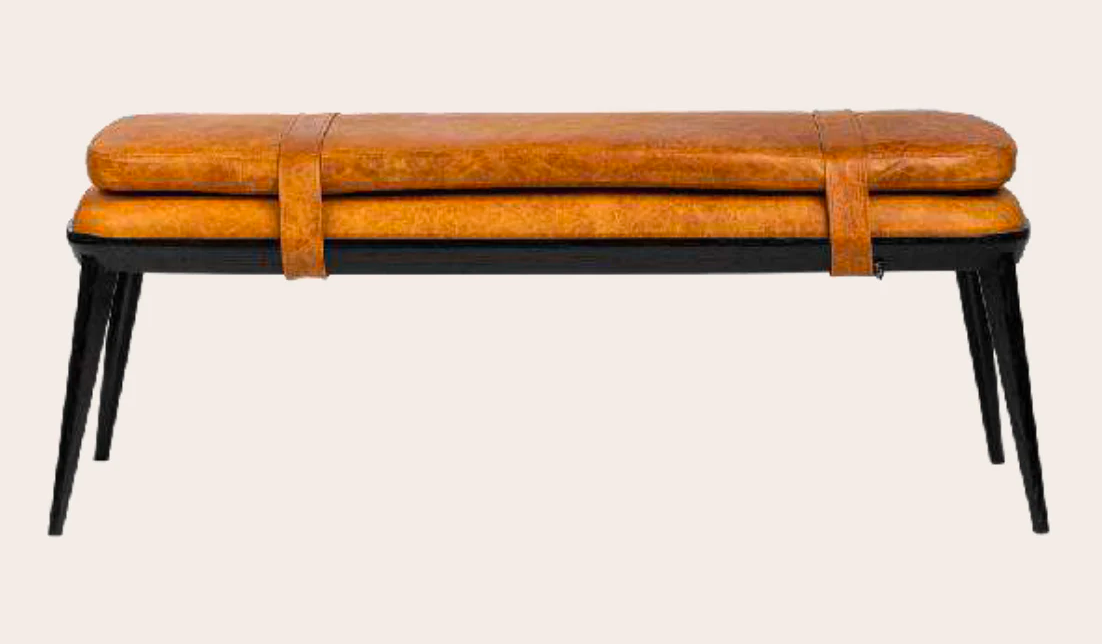 Brown leather bench with black legs on a white background