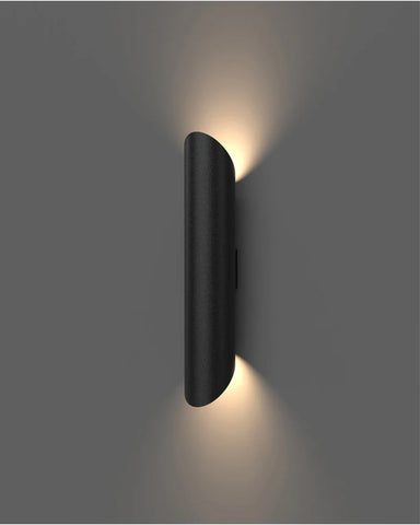 Black wall-mounted light fixture on a gray background